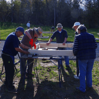 Volunteers building community gardens in Picton.